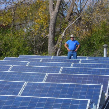 James Darabi of Solar Farm standing in a solar array MnSEIA member