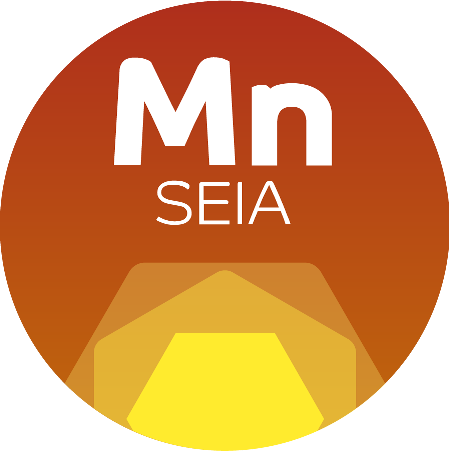 Orange MnSEIA button logo with yellow geometric sun at bottom