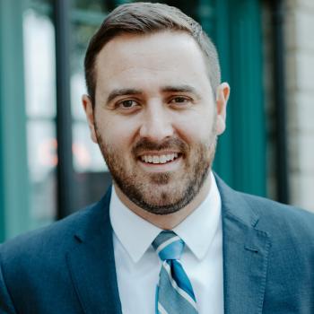 Logan O'Grady, MnSEIA Executive Director Staff Headshot
