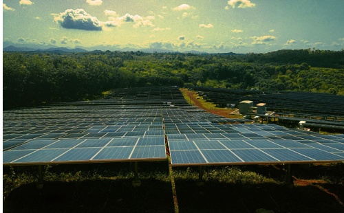 Solar panels in a row on a cloudy day